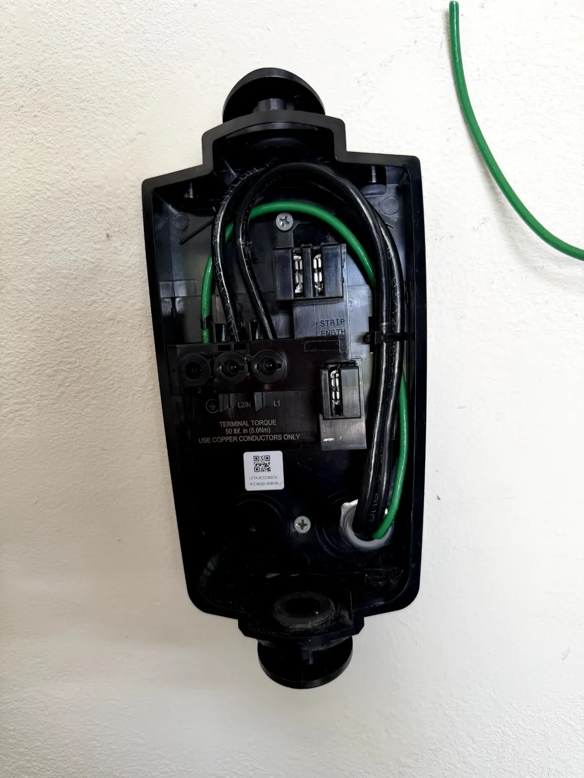 Licensed electrician installing a home EV charger in Florida